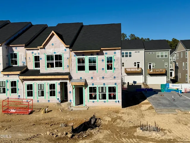 a view of multiple houses with a yard