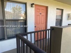 a view of a balcony with furniture