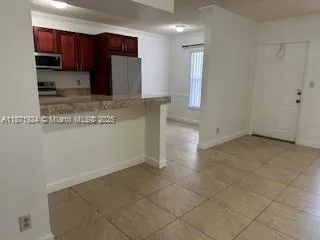 a view of a kitchen with a sink