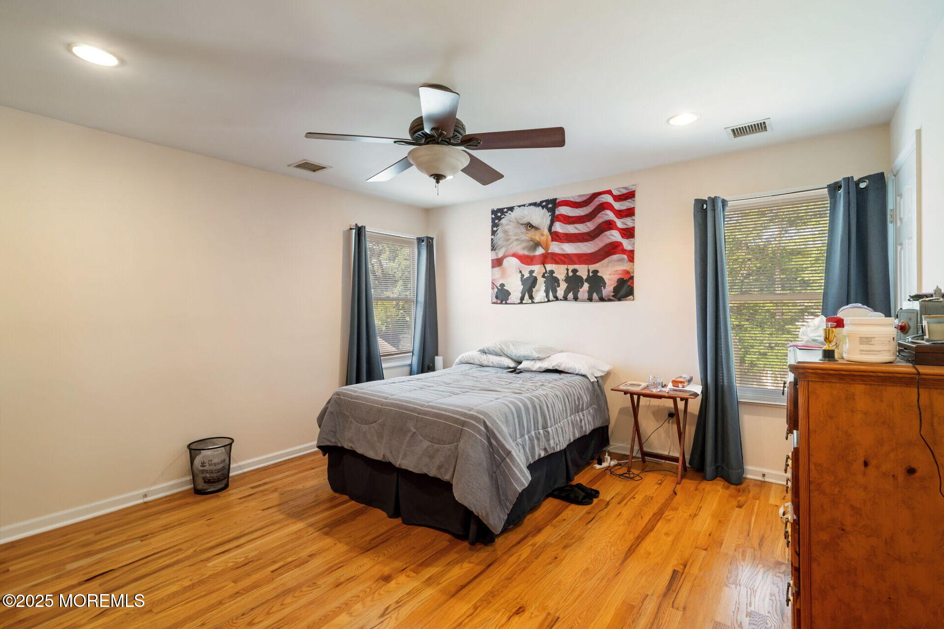 362 Broadway Keyport, NJ 07735 - Photo 11 of 18 a bedroom with a bed and a chandelier