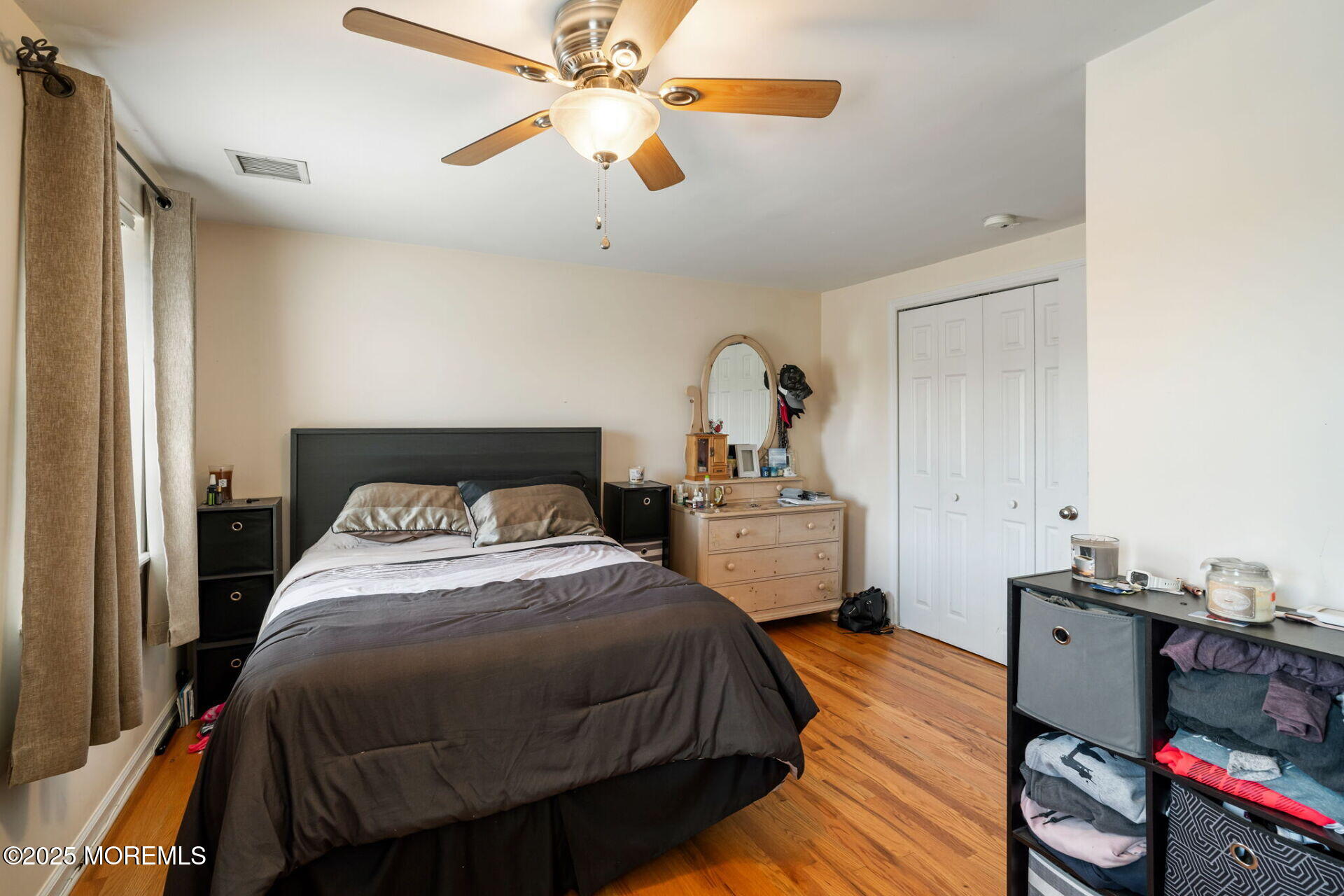 362 Broadway Keyport, NJ 07735 - Photo 12 of 18 a bedroom with a bed and a chandelier