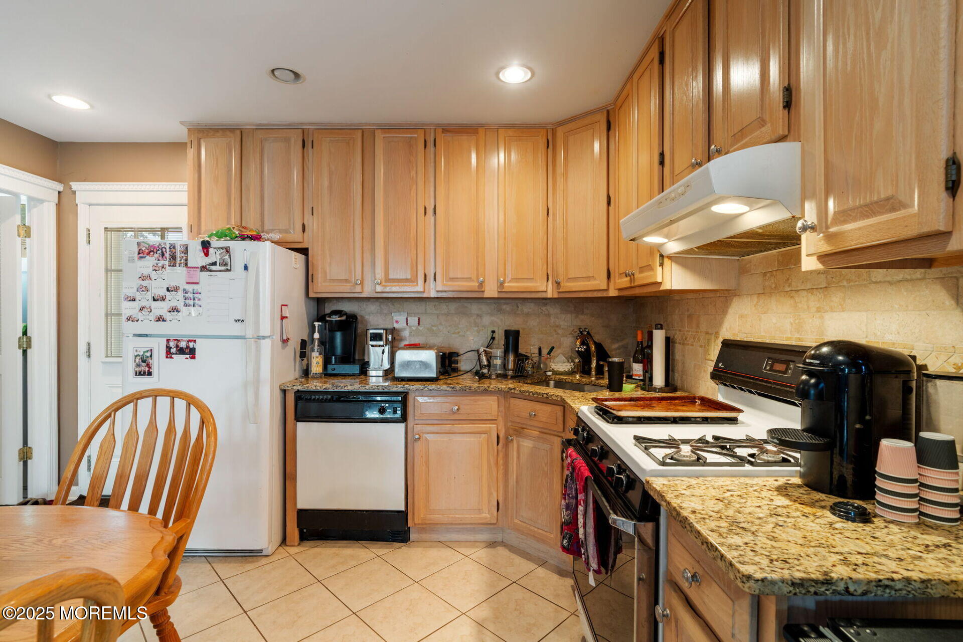 362 Broadway Keyport, NJ 07735 - Photo 8 of 18 a kitchen with granite countertop a stove and a refrigerator