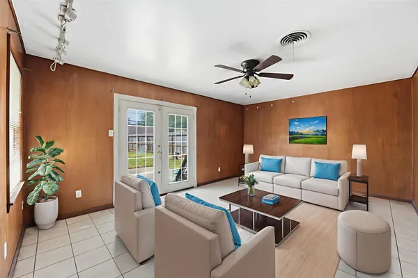 a living room with furniture and a window