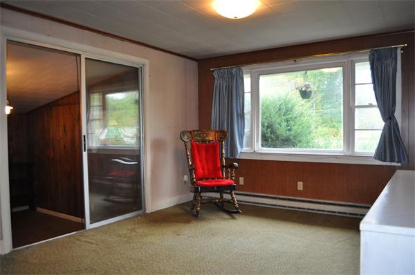 351 Ware Corner Road Oakham, MA 01068 - Photo 11 of 30 a room with window and air conditioner vent