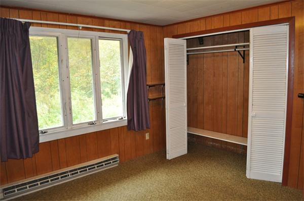 351 Ware Corner Road Oakham, MA 01068 - Photo 8 of 30 an empty room with windows