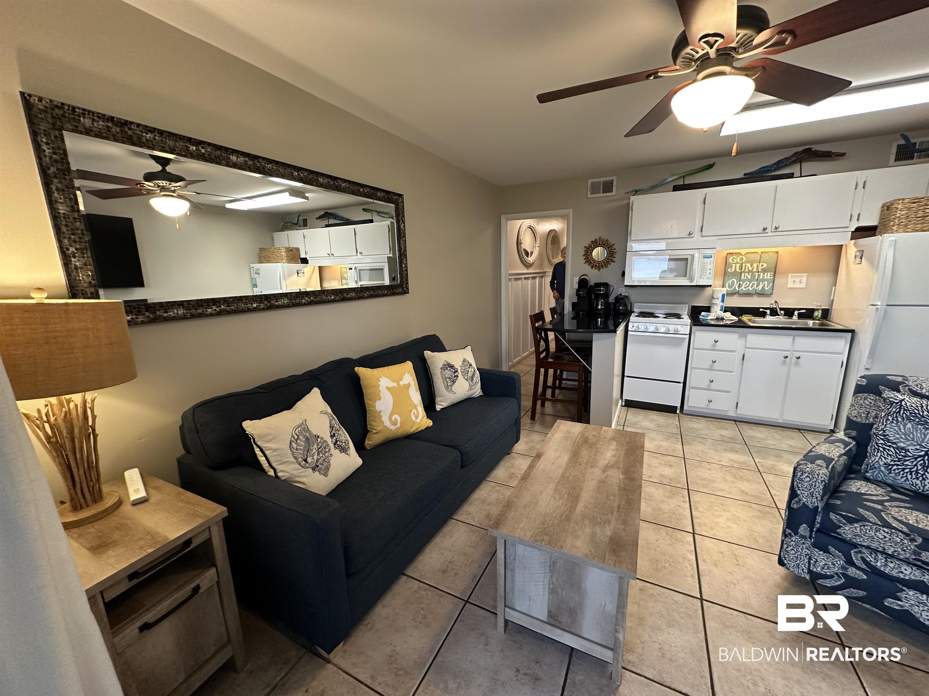 400 Plantation Road, Unit 2202 Gulf Shores, AL 36542 - Photo 16 of 26 Living room featuring ceiling fan and light tile patterned floors