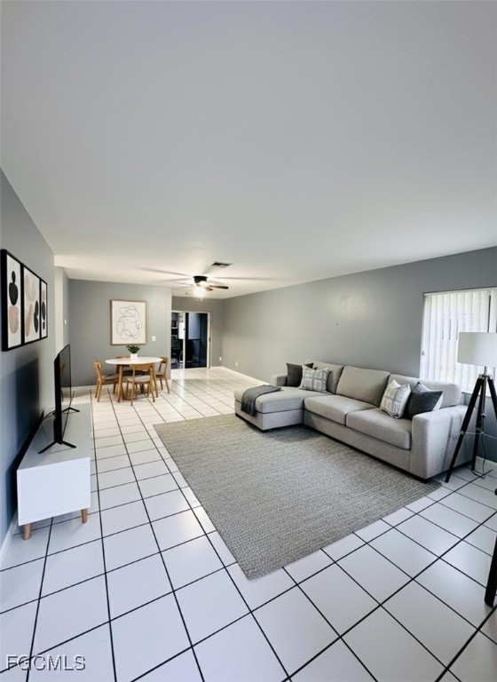 5256 Coronado Parkway Naples, FL 34116 - Photo 2 of 6 a living room with furniture and a table
