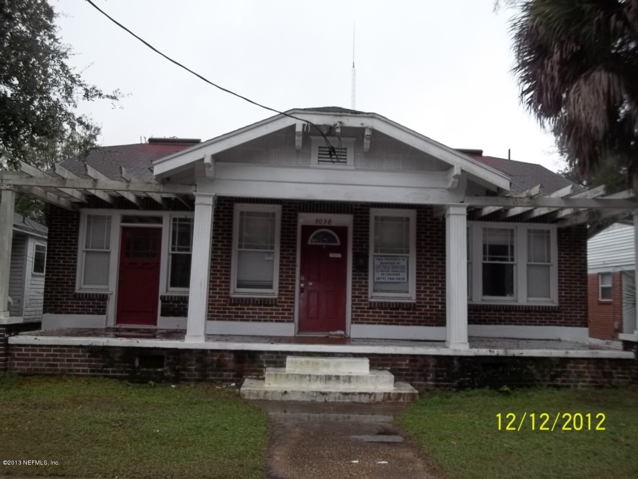 3038 Post Street Jacksonville, FL 32205 - Photo 1 of 13 a front view of a house with a garden