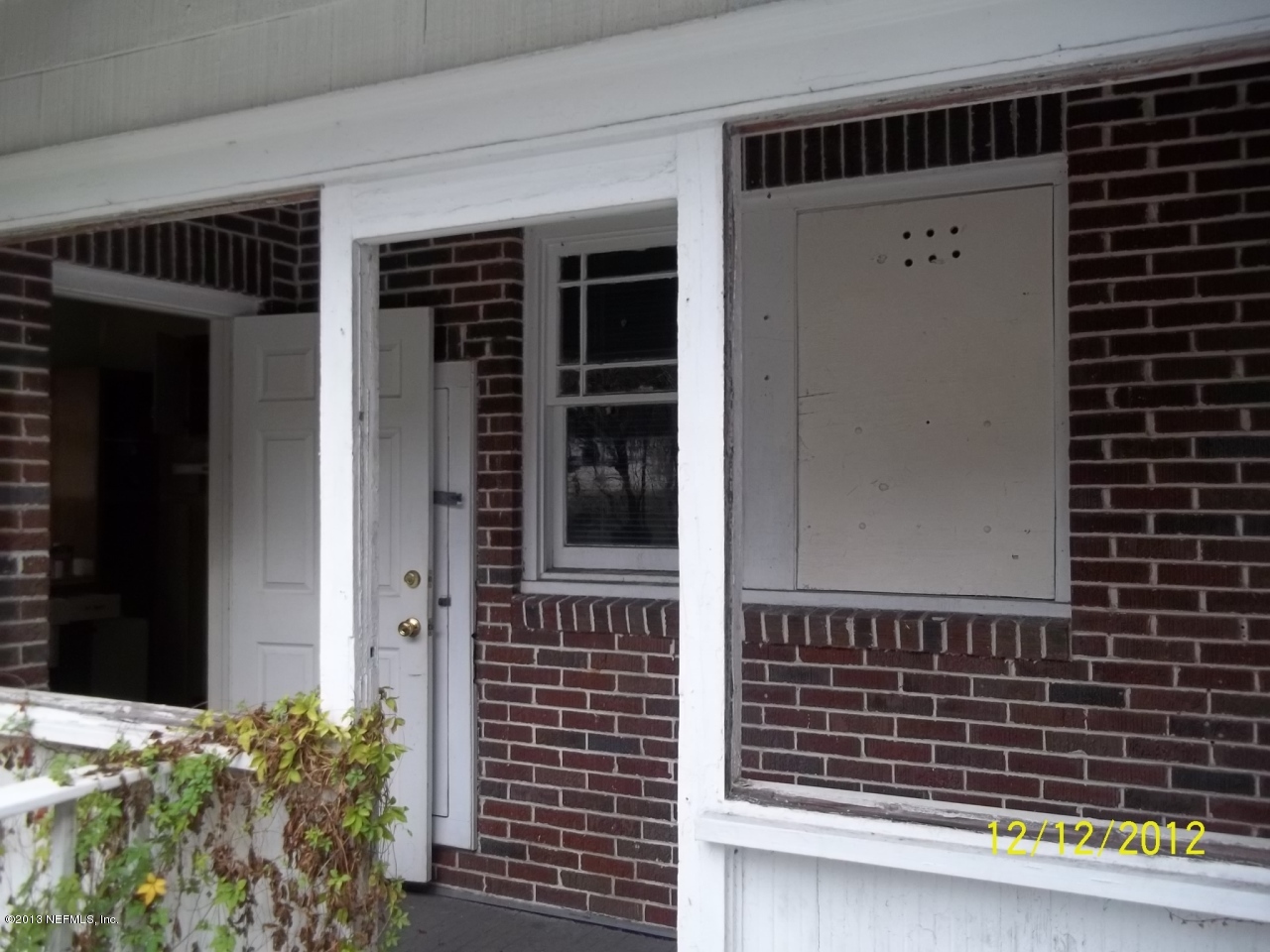 3038 Post Street Jacksonville, FL 32205 - Photo 13 of 13 a view of a door and a window