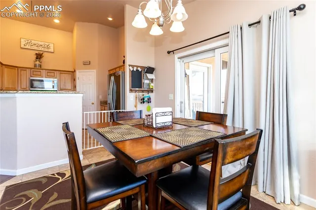 a kitchen with granite countertop a sink a counter top space appliances and cabinets