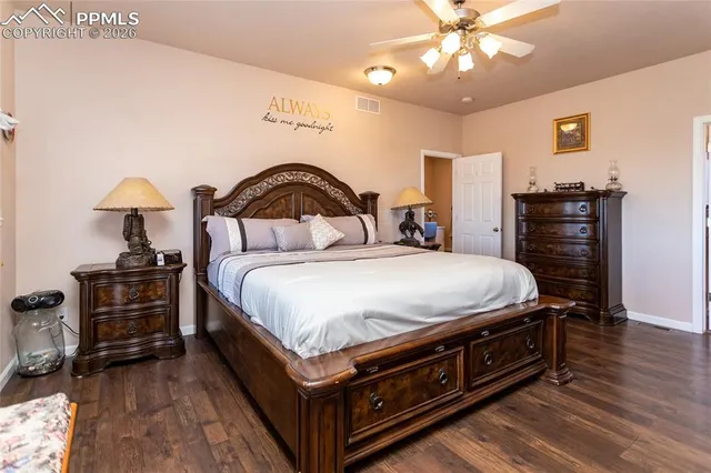 a bathroom with a granite countertop sink mirror and a bathtub