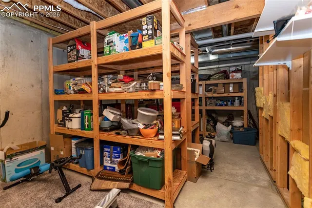 a furnished livingroom with a ceiling fan