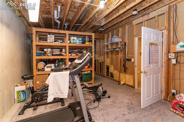 a view of an empty room with a fireplace