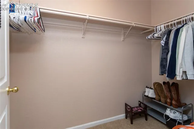a view of balcony with wooden floor and seating space