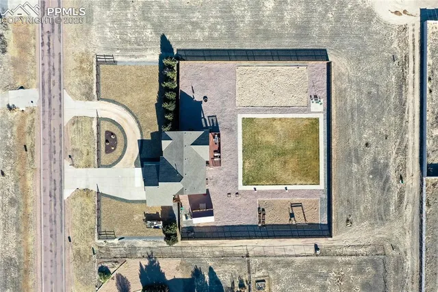 an aerial view of residential building with parking space