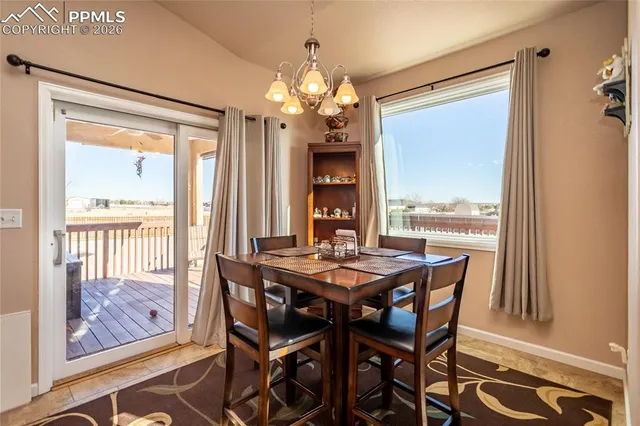 a kitchen with stainless steel appliances granite countertop a refrigerator and a stove