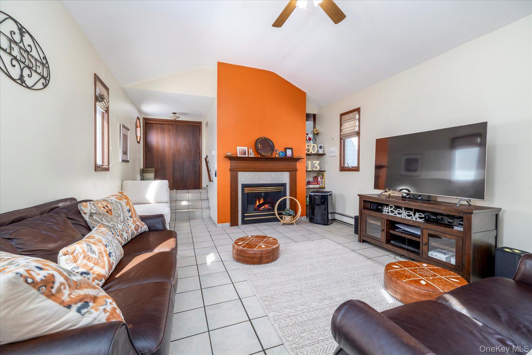 982 Adams Street Baldwin, NY 11510 - Photo 15 of 28 a living room with furniture and a flat screen tv