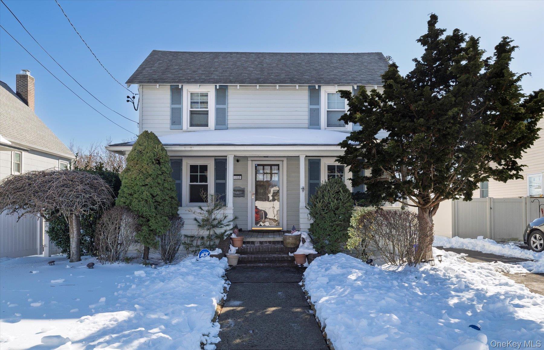 982 Adams Street Baldwin, NY 11510 - Photo 2 of 28 a front view of a house with garden