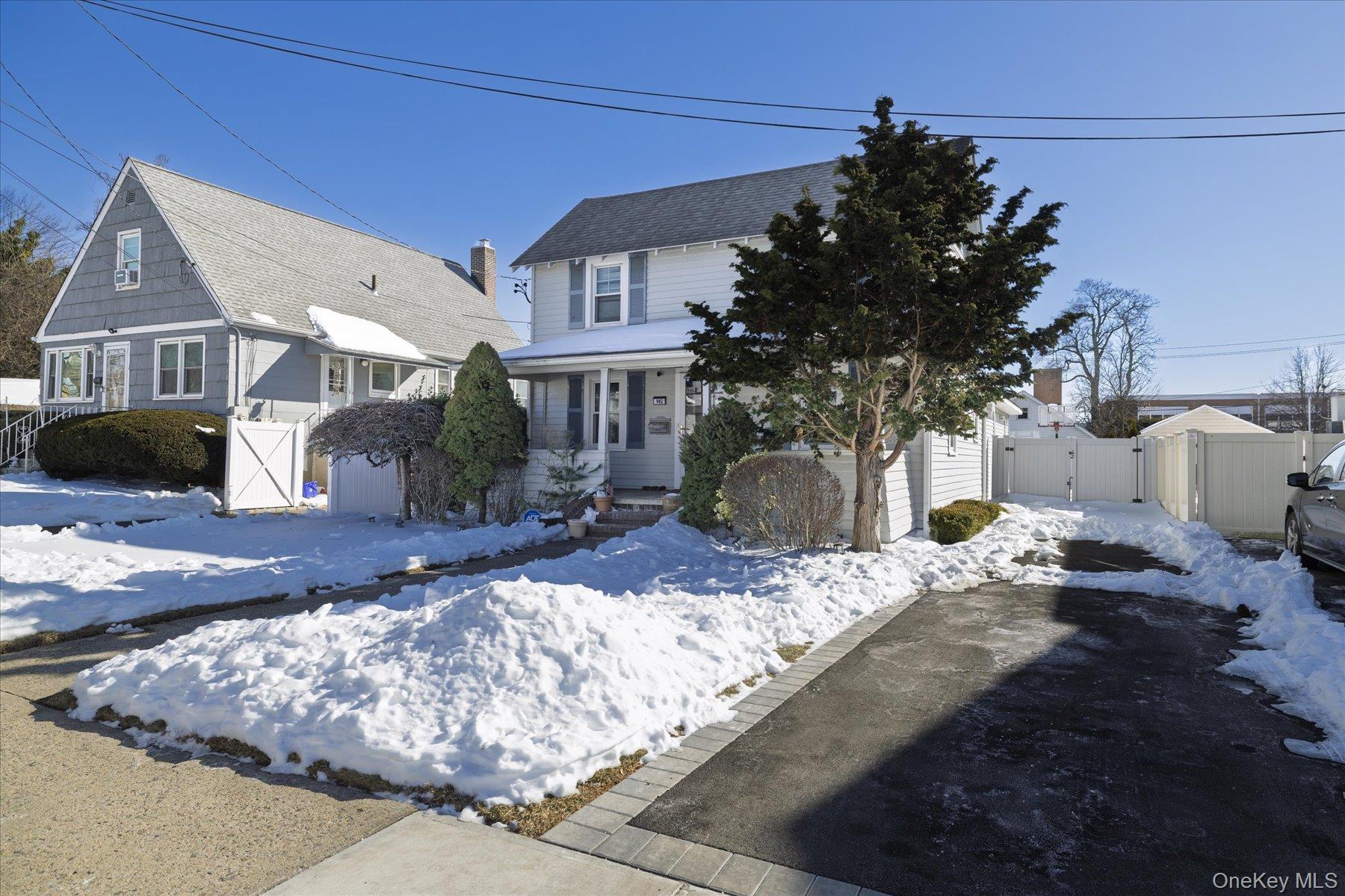 982 Adams Street Baldwin, NY 11510 - Photo 4 of 28 a front view of a house with garden