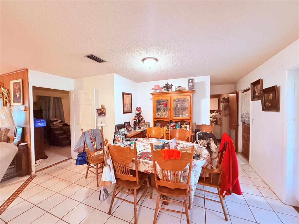 393 Southwest 72nd Terrace Okeechobee, FL 34974 - Photo 13 of 21 a group of people sitting in a living room