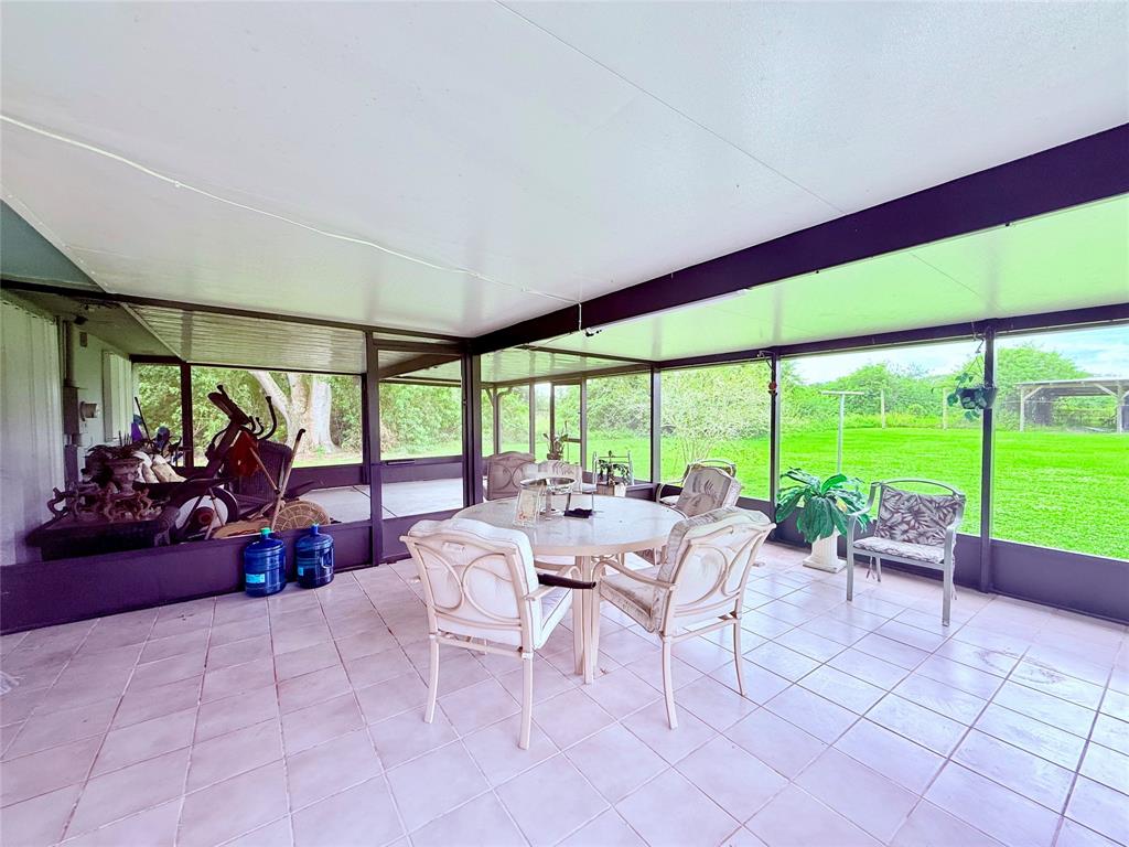 393 Southwest 72nd Terrace Okeechobee, FL 34974 - Photo 19 of 21 a very nice looking room with a large window and sitting space