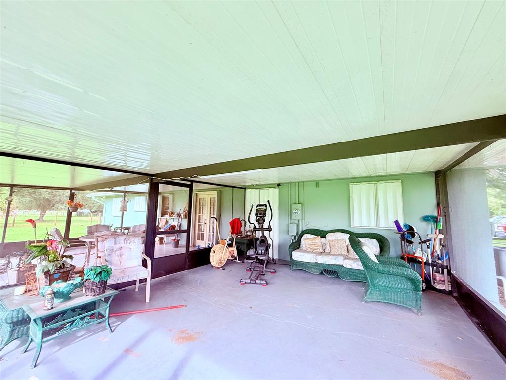 393 Southwest 72nd Terrace Okeechobee, FL 34974 - Photo 20 of 21 a bedroom with furniture and a large window