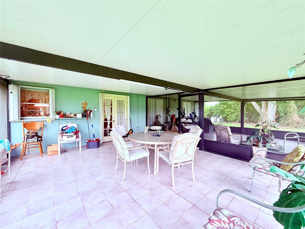 393 Southwest 72nd Terrace Okeechobee, FL 34974 - Photo 21 of 21 a view of a dining area with furniture and a window