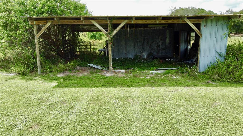 393 Southwest 72nd Terrace Okeechobee, FL 34974 - Photo 7 of 21 a view of backyard with green space