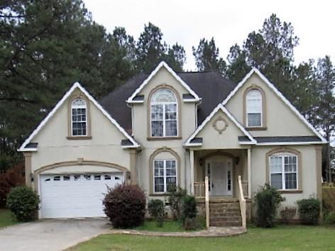 443 Annies Path Gray, GA 31032 - Photo 1 of 23 a front view of a house with a yard