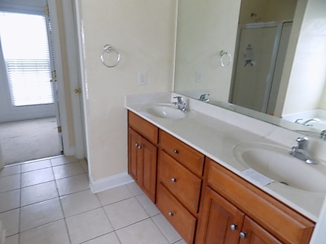 443 Annies Path Gray, GA 31032 - Photo 13 of 23 a bathroom with a double vanity sink a mirror and a