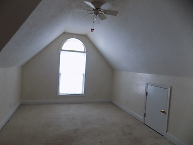 443 Annies Path Gray, GA 31032 - Photo 16 of 23 an empty room with a window and a chandelier fan
