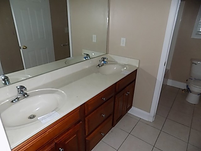 443 Annies Path Gray, GA 31032 - Photo 19 of 23 a spacious bathroom with a double vanity sink and a mirror