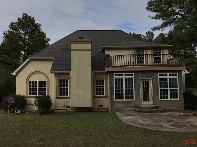 443 Annies Path Gray, GA 31032 - Photo 3 of 23 a front view of a house with a garden