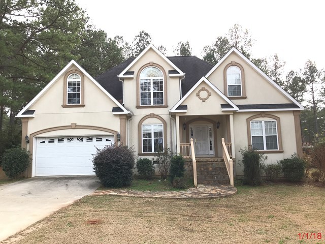 443 Annies Path Gray, GA 31032 - Photo 23 of 23 a front view of a house with a yard and garage