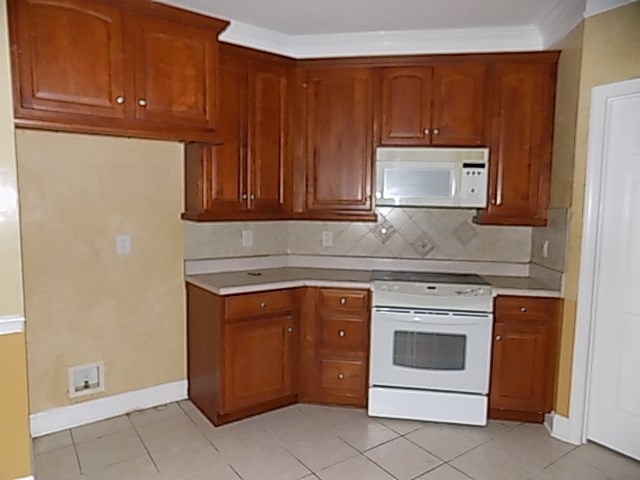 443 Annies Path Gray, GA 31032 - Photo 8 of 23 a kitchen with a stove and a microwave