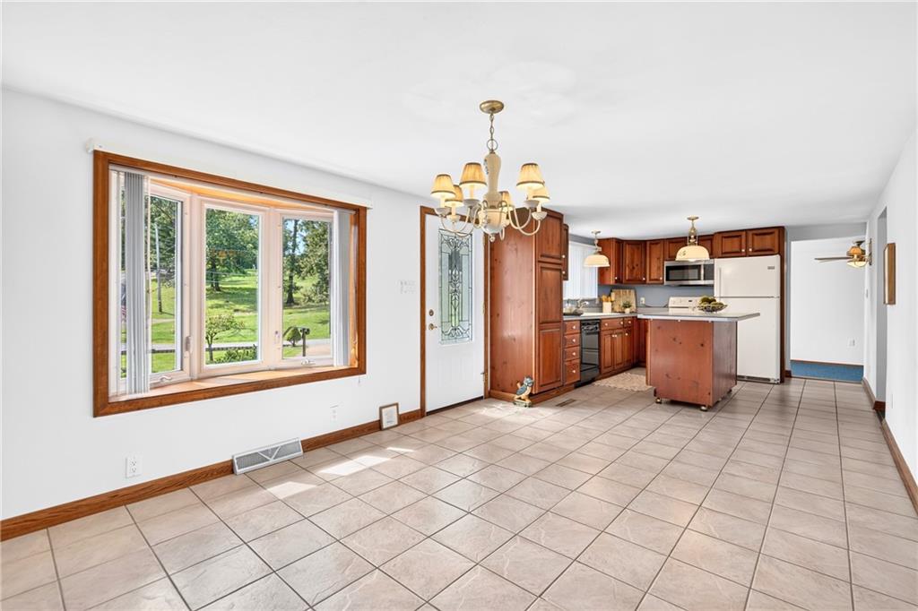 312 Gringo Independence Road, Unit R Aliquippa, PA 15001 - Photo 3 of 49 Enter the spacious eat-in kitchen, featuring a beautiful bay window that fills the space with abundant natural light.