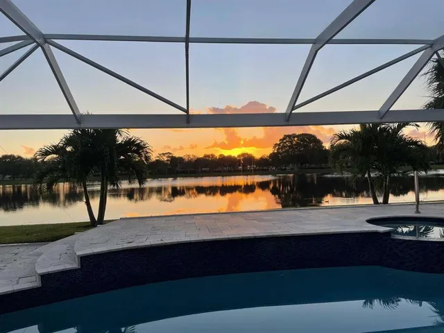 a view of swimming pool with an outdoor seating