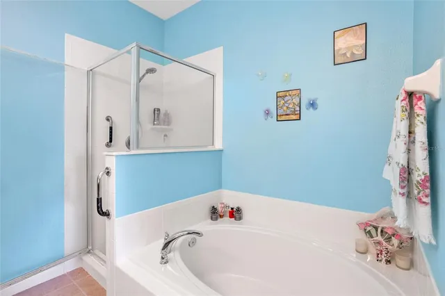 a bathroom with a bathtub and a window