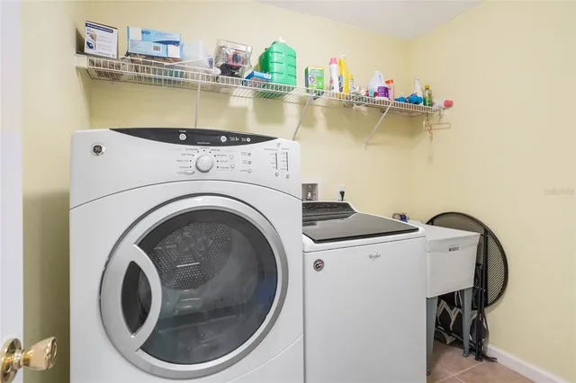 a utility room with dryer and washer