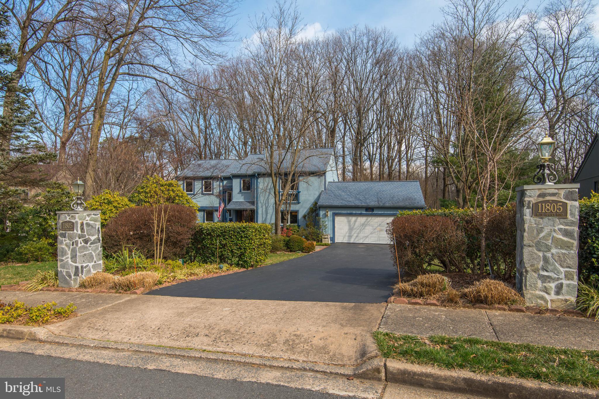 11805 Blue Spruce Road Reston, VA 20191 - Photo 2 of 74 a front view of a house with a yard and tree s