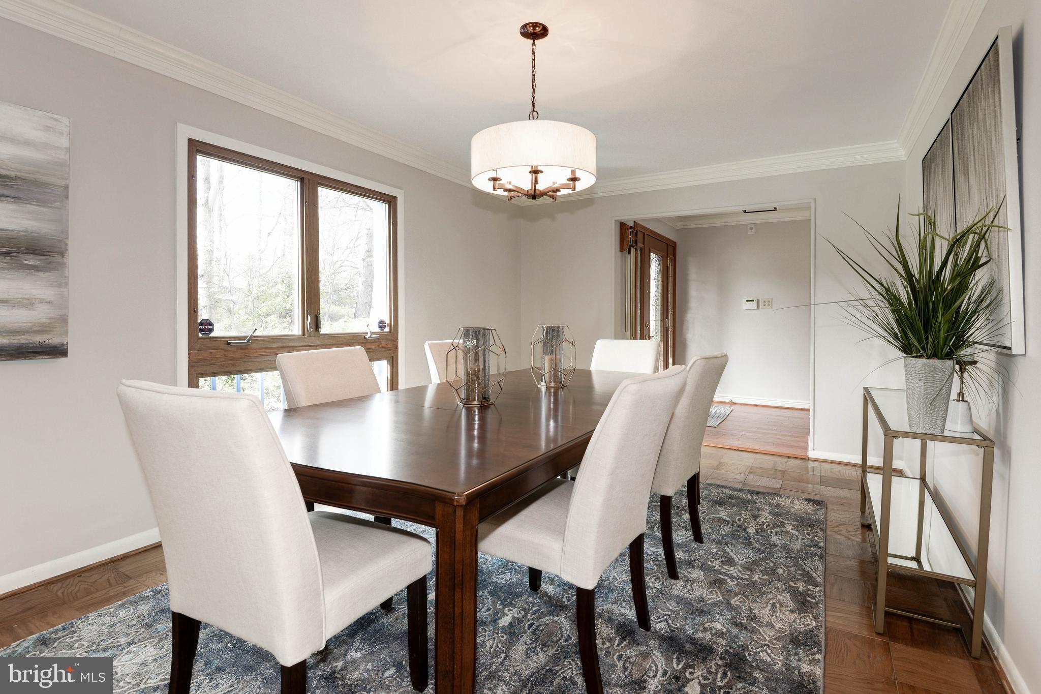 11805 Blue Spruce Road Reston, VA 20191 - Photo 11 of 74 a view of a dining room with furniture window and wooden floor