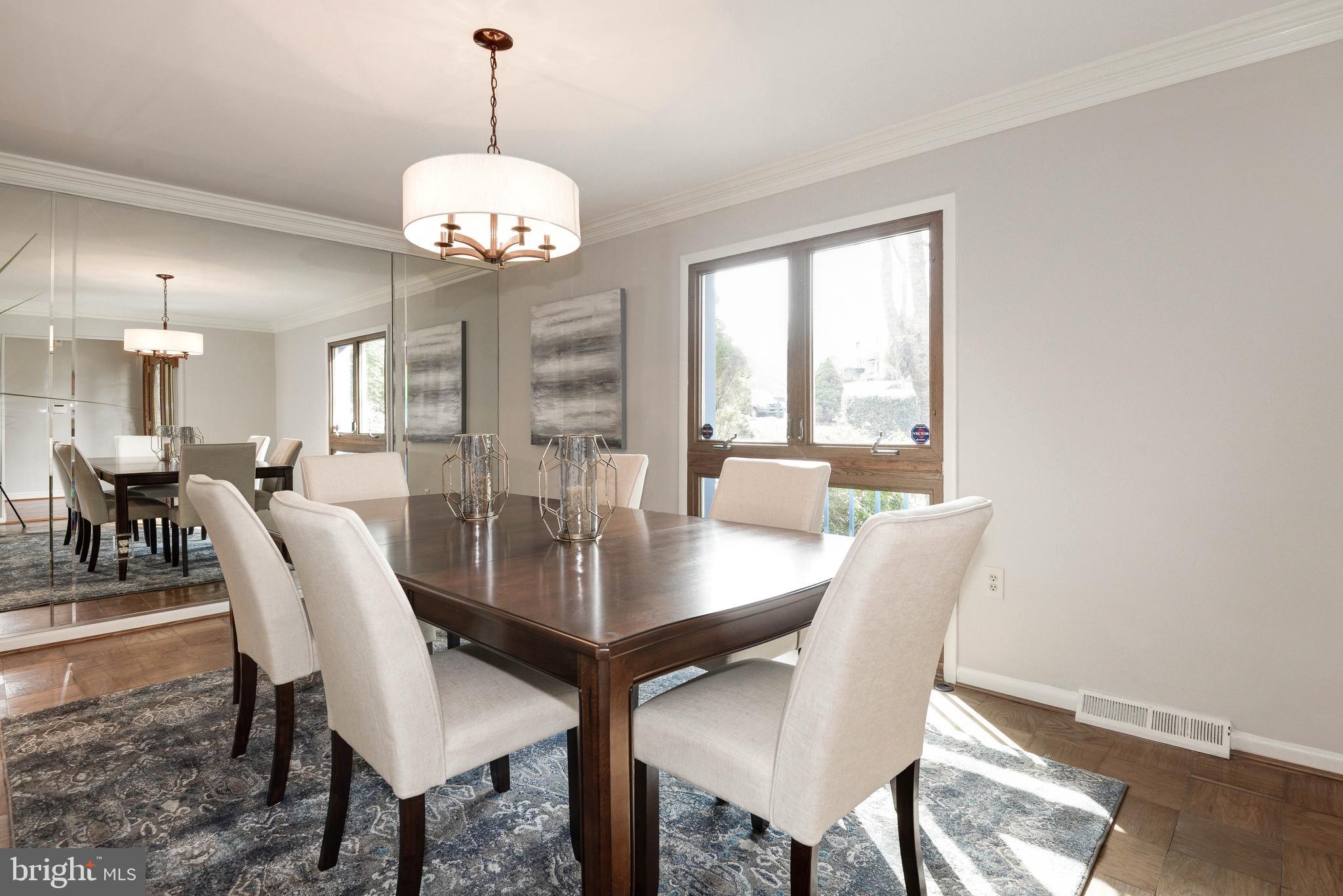 11805 Blue Spruce Road Reston, VA 20191 - Photo 12 of 74 a view of a dining room with furniture window and wooden floor
