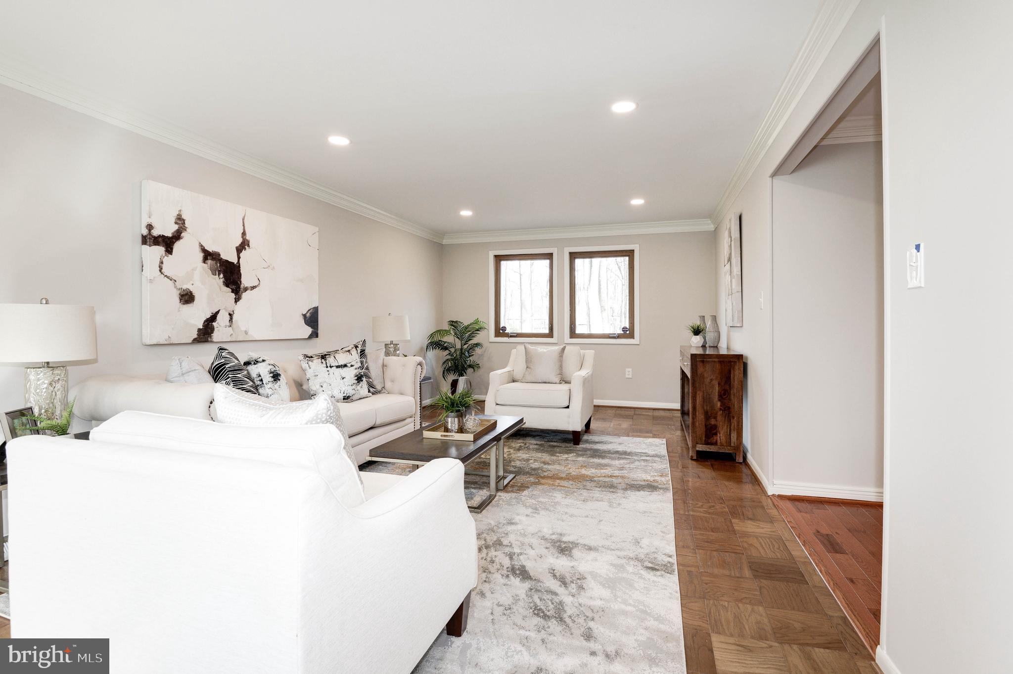 11805 Blue Spruce Road Reston, VA 20191 - Photo 15 of 74 a living room with furniture and a table