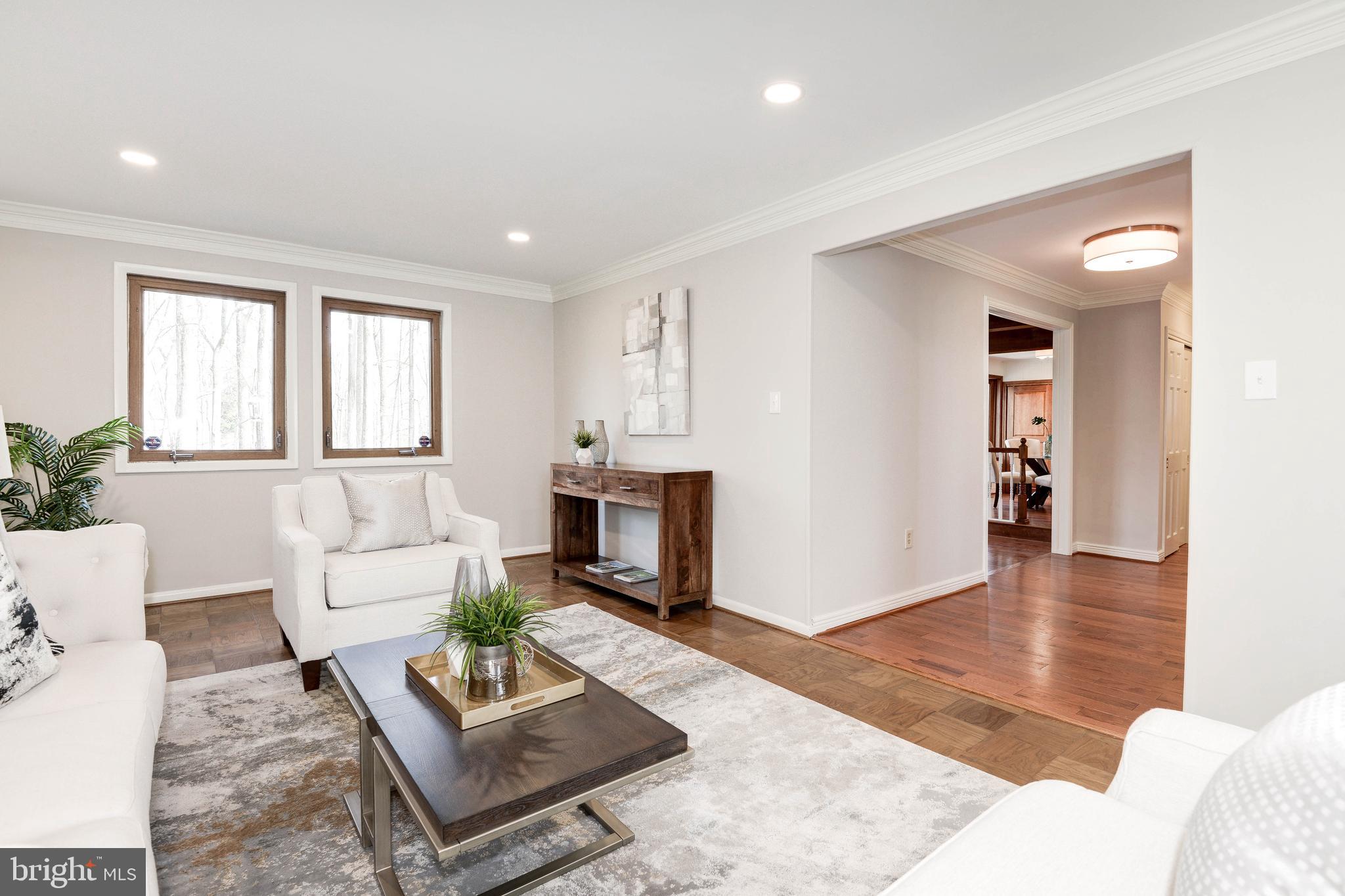 11805 Blue Spruce Road Reston, VA 20191 - Photo 17 of 74 a living room with furniture and a fireplace
