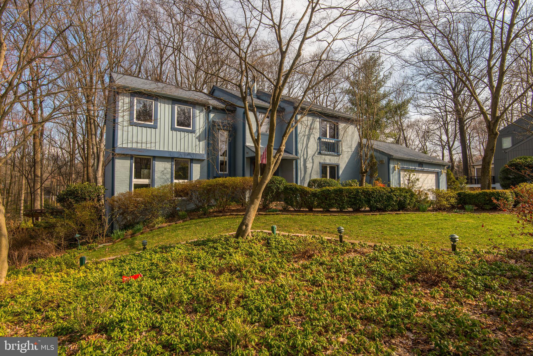 11805 Blue Spruce Road Reston, VA 20191 - Photo 3 of 74 a house that has a big yard and large trees