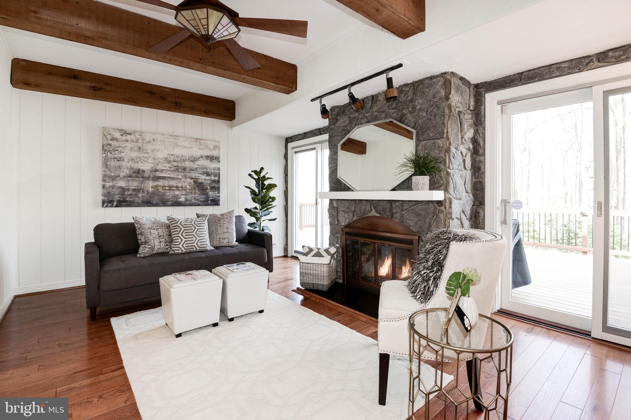 11805 Blue Spruce Road Reston, VA 20191 - Photo 23 of 74 a living room with furniture and a fireplace