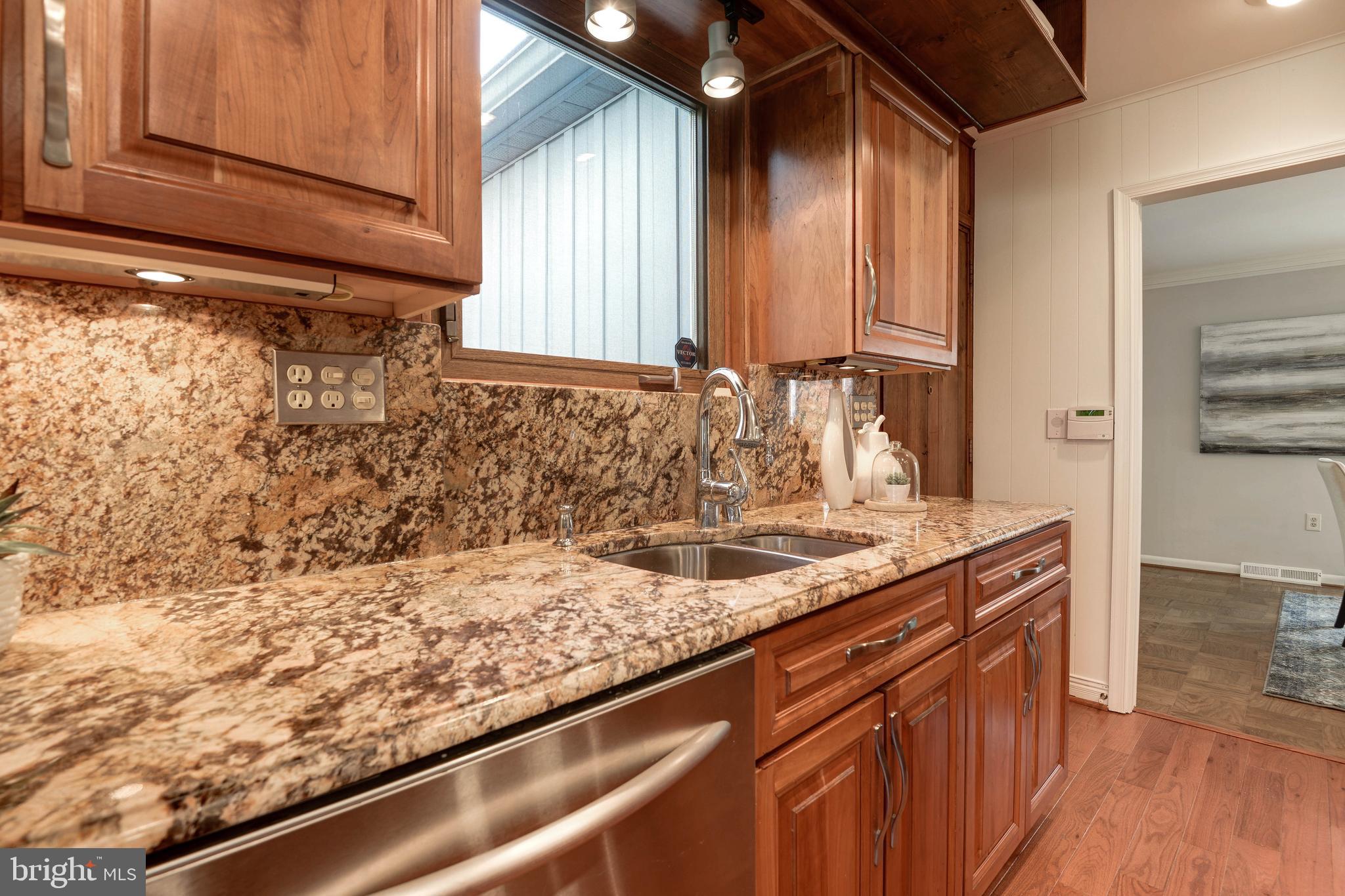 11805 Blue Spruce Road Reston, VA 20191 - Photo 28 of 74 a kitchen with a sink and a window