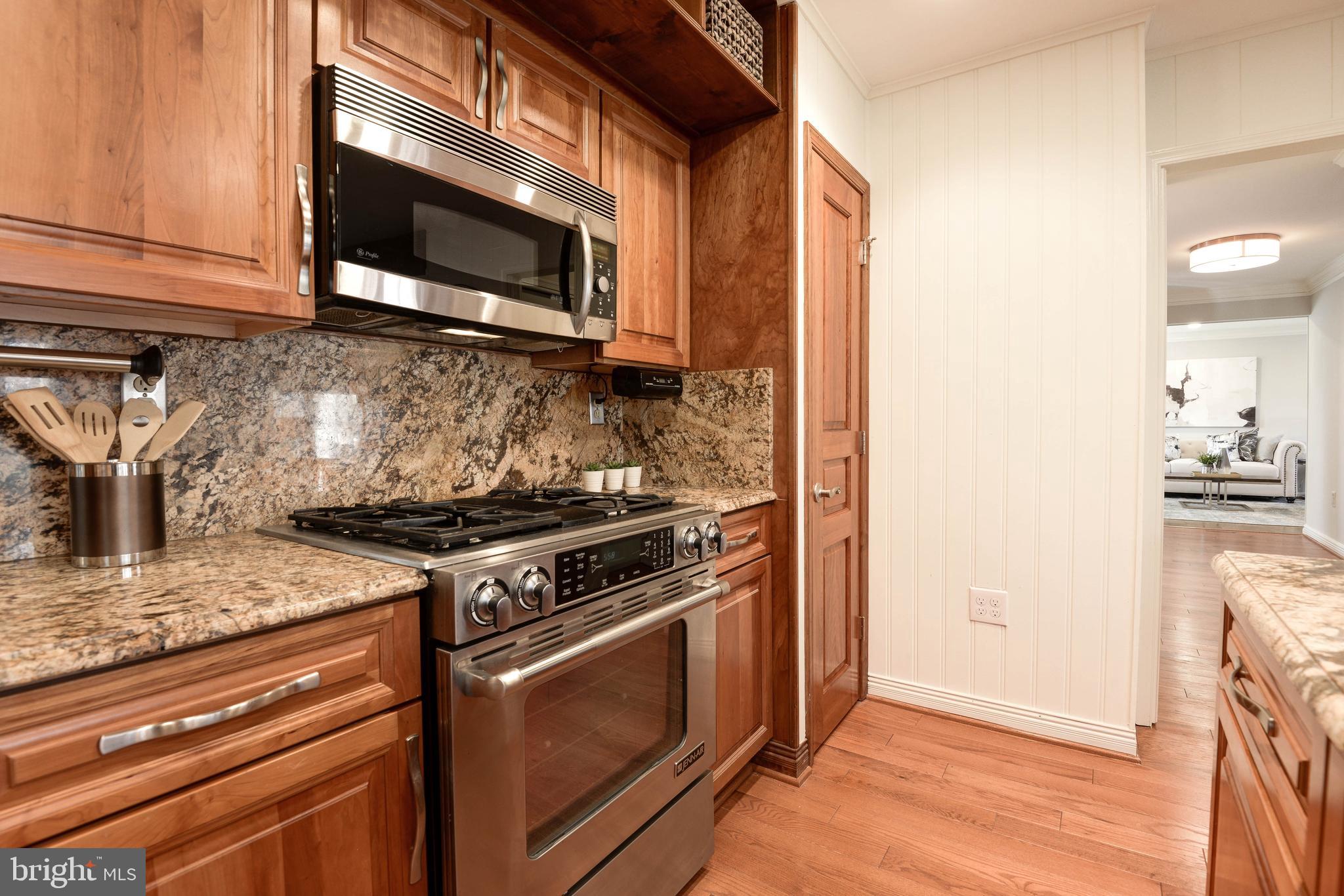 11805 Blue Spruce Road Reston, VA 20191 - Photo 29 of 74 a kitchen with a stove and a microwave