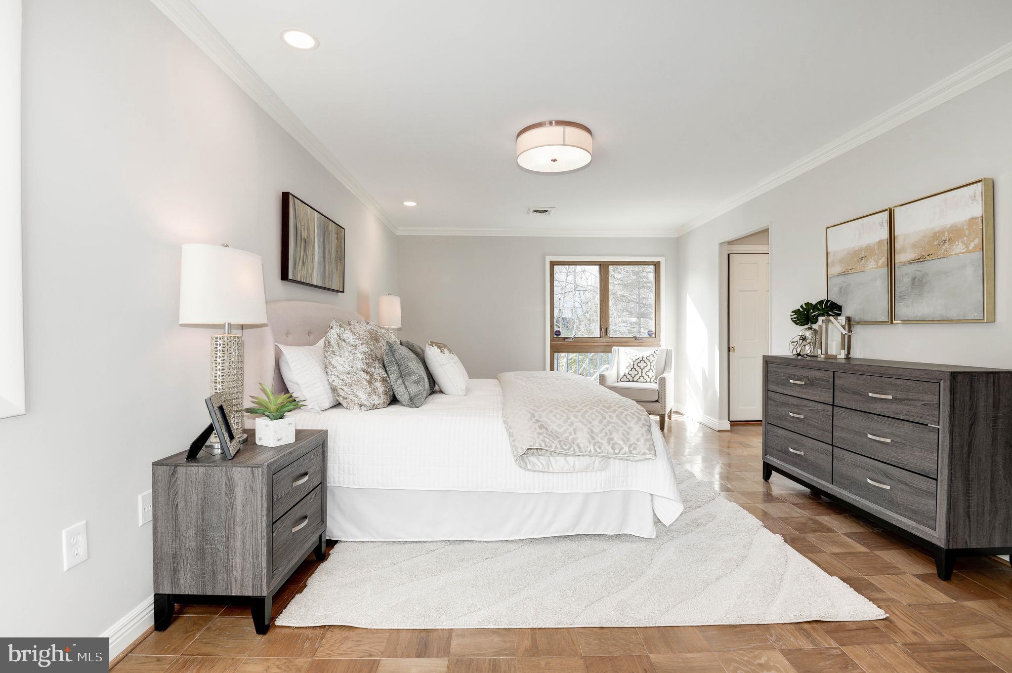 11805 Blue Spruce Road Reston, VA 20191 - Photo 38 of 74 a large white bed in a white room