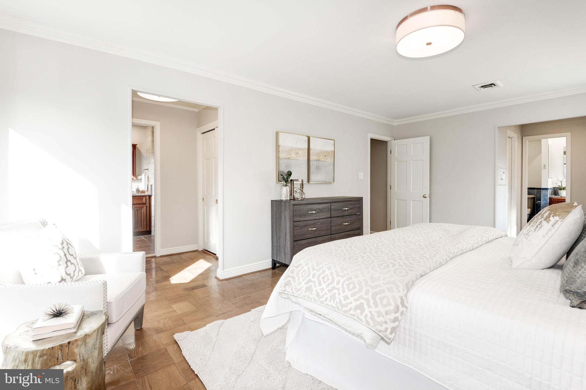 11805 Blue Spruce Road Reston, VA 20191 - Photo 40 of 74 a spacious bedroom with a bed and a dresser